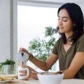 female-pouring-coffee-morning-scaled (1) 1